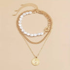 Perlen- und Vintage-Anhänger-Kette - 3 Teile Anhänger und Perlenhalskette