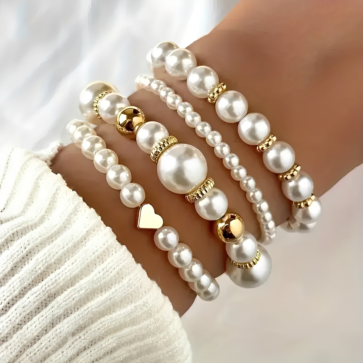 Damen 4-teiliges stapelbares Armband-Set mit Perlendetails und Herzanhänger