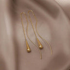 Amaris – Ohrringe mit goldenen Tropfen und Quasten