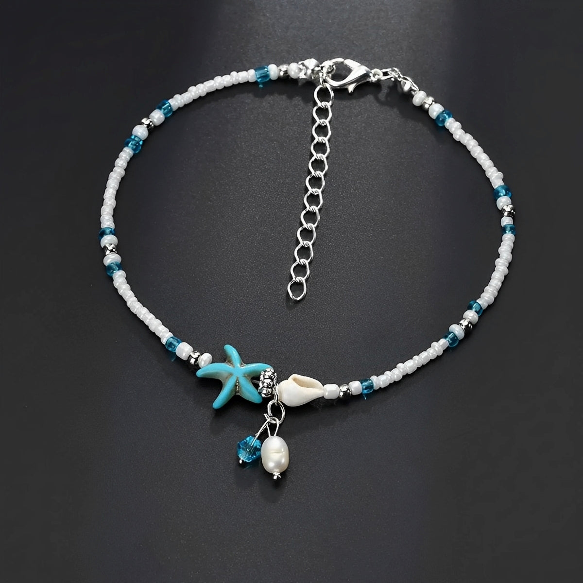 Isla – Knöchelarmband mit Stern, Muschel und Natursteinen