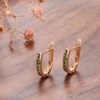Christine – Goldene Ohrringe mit Smaragd und Diamant