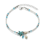 Isla – Knöchelarmband mit Stern, Muschel und Natursteinen